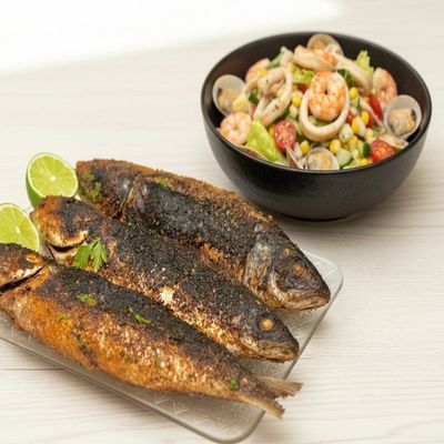 Grilled mullet fish and seafood salad