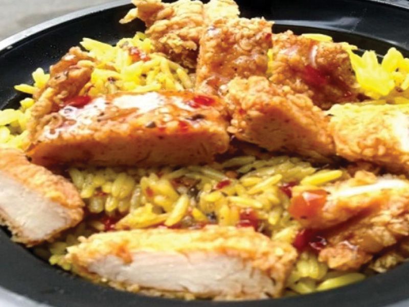 Rizo rice is a casserole of rice and rizo sauce with pieces of chicken
