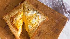 Eggs With Hot Triangle Cheese Sandwich