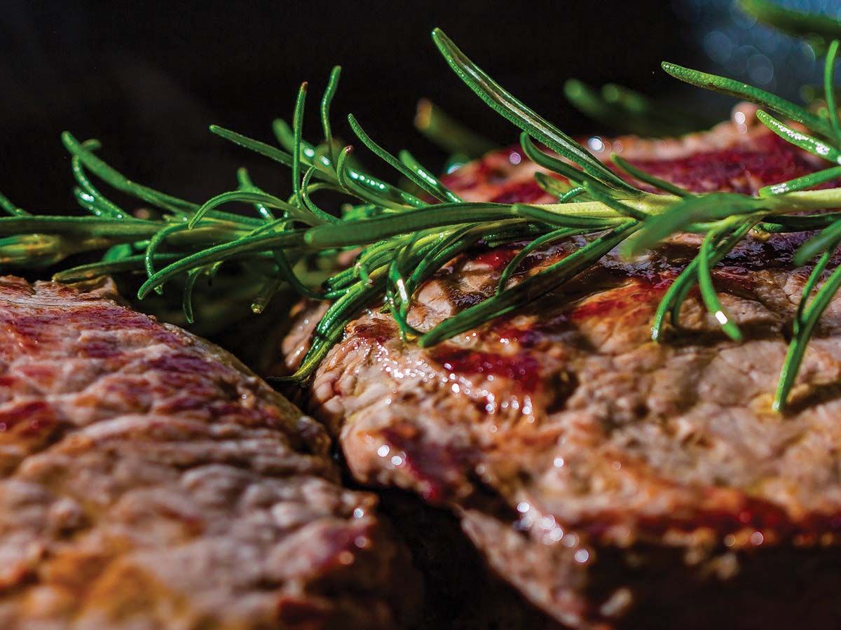Steak with butter and rosemary Plate