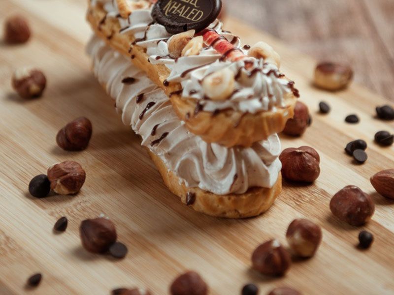 Piece of French eclair praline hazelnut