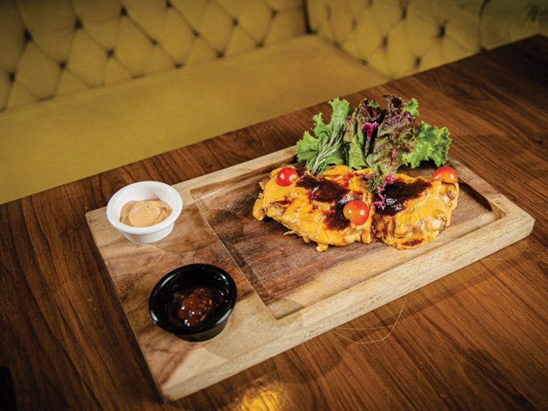Chicken under brick