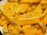French Fries with cheddar sauce packet