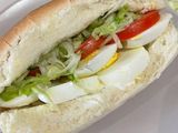 Boiled egg with cheese and tomato sandwich