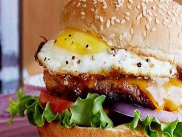 Egg and cheese burger sandwich with fries and Pepsi