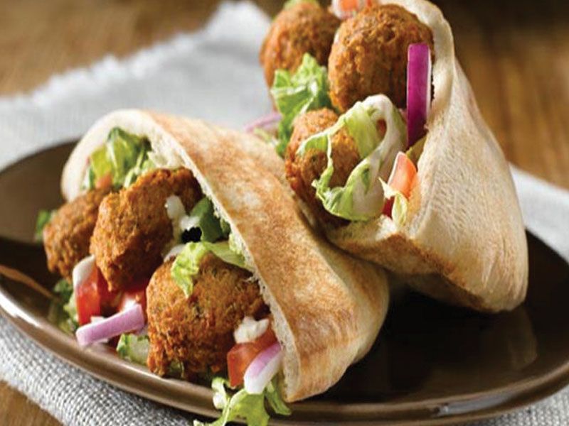 Falafel sandwich, salad and tahini