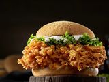 Fried chicken sandwich and sauces with potatoes