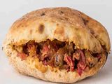 Foul with pastrami sandwich