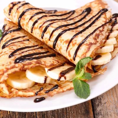 Crepe With Chocolate, Banana, Nuts And Marshmallow