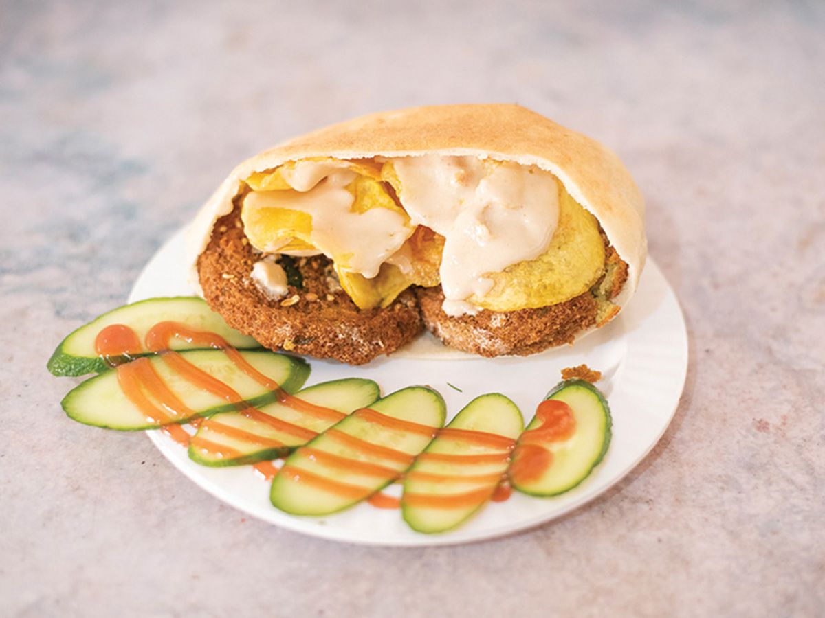 Taamia with potato chips sandwich