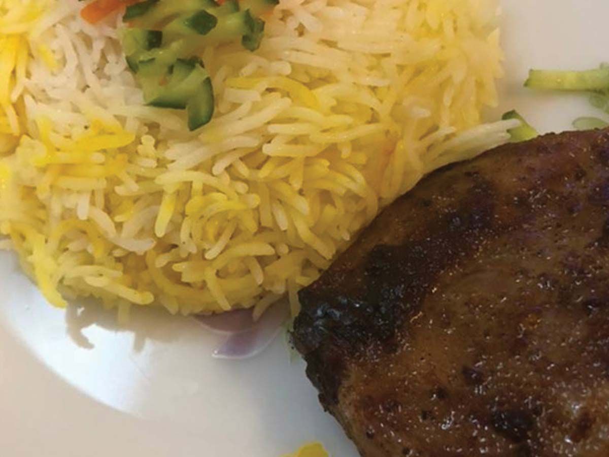 Grilled ostrich steak pieces with basmati rice