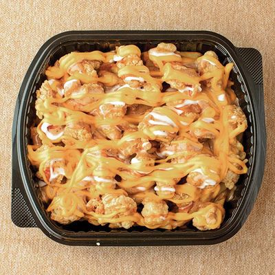 Crispy meal with golden cheddar sauce