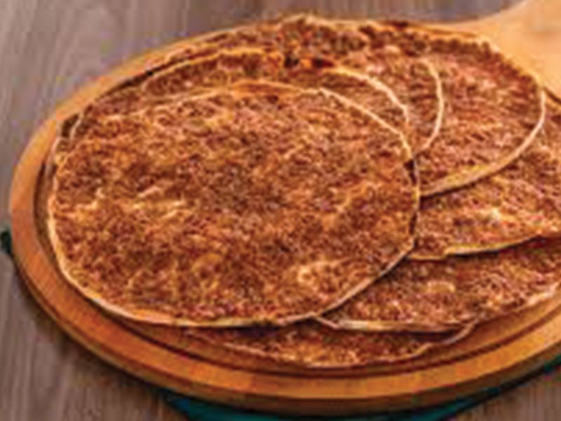 Veal Meat On Dough With Frozen Pomegranate Molasses