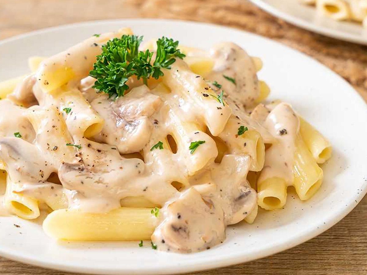 Large white sauce pasta with chicken and mozzarella or cheddar