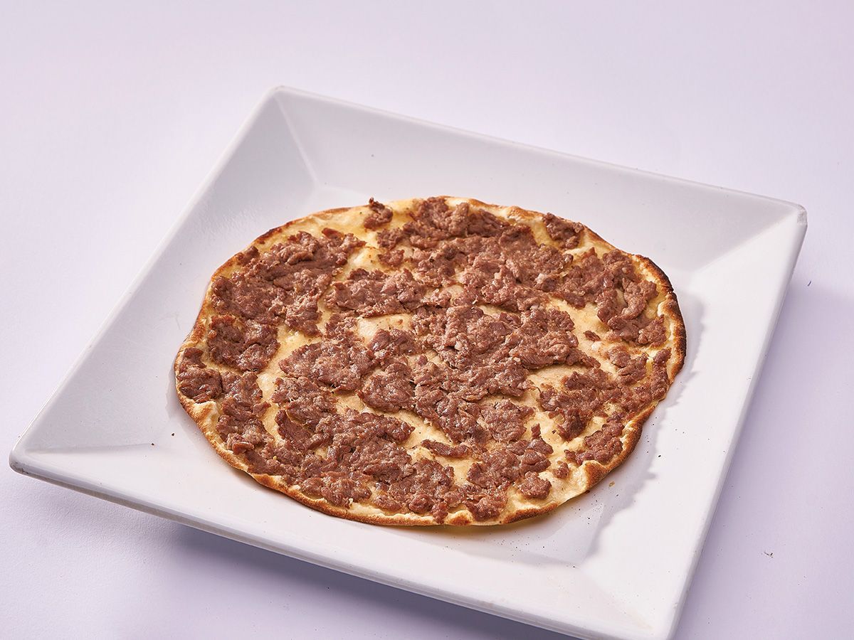 Half a kilo of red meat on dough