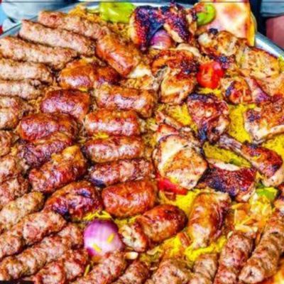 Half a chicken, half a mixed Kandouz, rice and potatoes