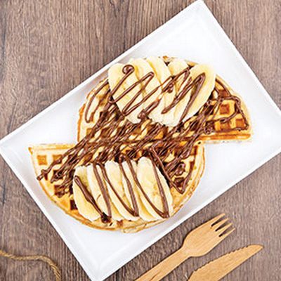 Chocolate waffle with banana and nuts