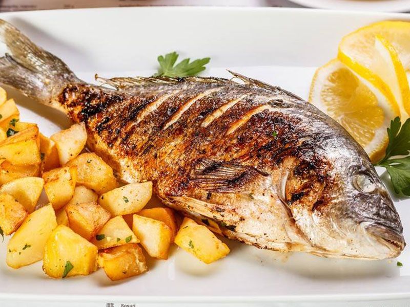 Grilled Tilapia Fish With Oil And Lemon