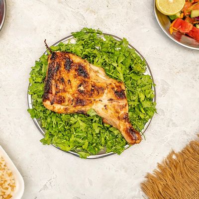 1/4 chicken thigh with rice and vegetables meal