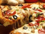 With 1 EGP, a box of rocher tamuros Plus large pizza, Italian vegetables, tomato sauce, mozzarella, vegetables, peppers and olives